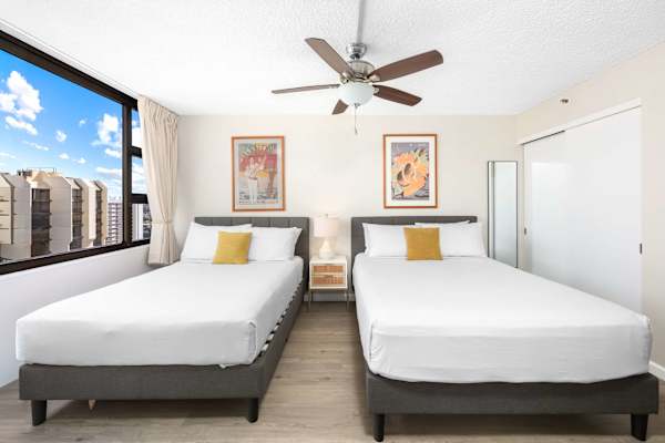 Sink into comfort in our cozy bedroom, featuring a plush queen-size bed and a comfortable full-size bed—perfect for couples, friends, or small families seeking a restful night’s sleep.