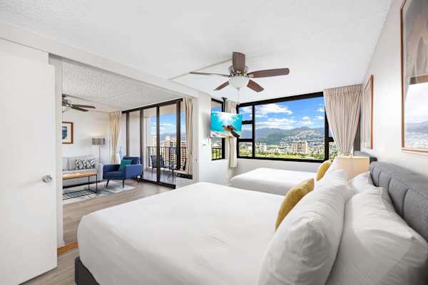 The bedroom sits just across the living room and is separated by a sliding door, offering privacy when you need it and an open, airy flow when you don’t.