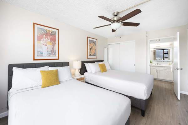 Sink into comfort in our cozy bedroom, featuring a plush queen-size bed and a comfortable full-size bed—perfect for couples, friends, or small families seeking a restful night’s sleep.