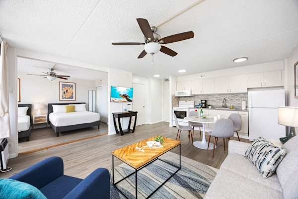 The bedroom sits just across the living room and is separated by a sliding door, offering privacy when you need it and an open, airy flow when you don’t.