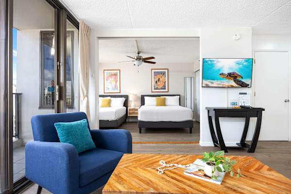The bedroom sits just across the living room and is separated by a sliding door, offering privacy when you need it and an open, airy flow when you don’t.