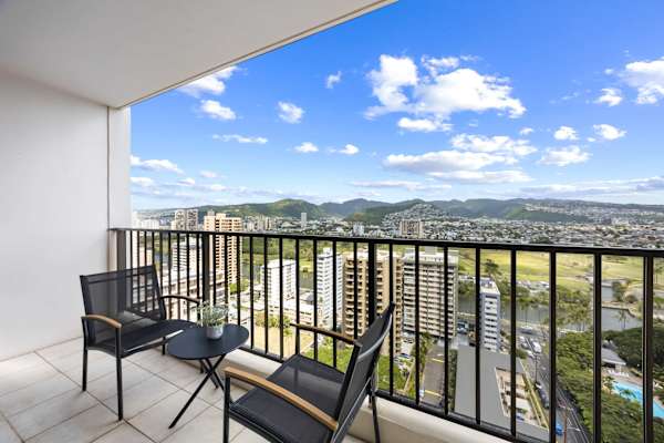 Grab your morning coffee or unwind with a drink on the balcony—stunning mountain views and a cozy table for two.