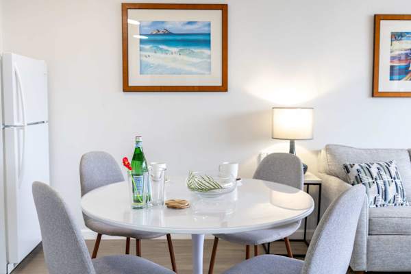 Dine comfortably at the intimate round table with four chairs—perfect for cozy breakfasts, casual meals, or small gatherings.
