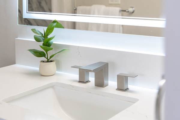Unwind in a spacious, modern bathroom with sleek finishes and a luxurious bathtub—your private spa-style retreat.