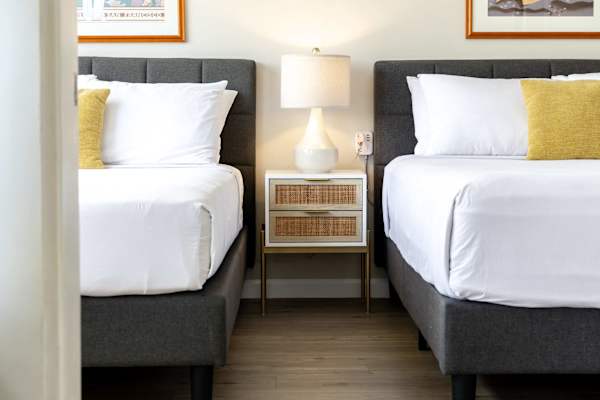 Sink into comfort in our cozy bedroom, featuring a plush queen-size bed and a comfortable full-size bed—perfect for couples, friends, or small families seeking a restful night’s sleep.