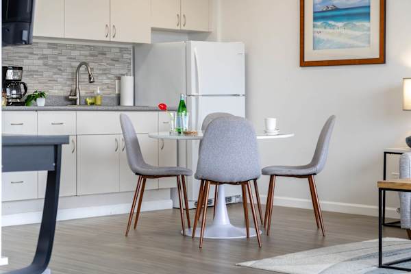 Dine comfortably at the intimate round table with four chairs—perfect for cozy breakfasts, casual meals, or small gatherings.