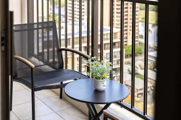 Grab your morning coffee or unwind with a drink on the balcony—stunning mountain views and a cozy table for two.