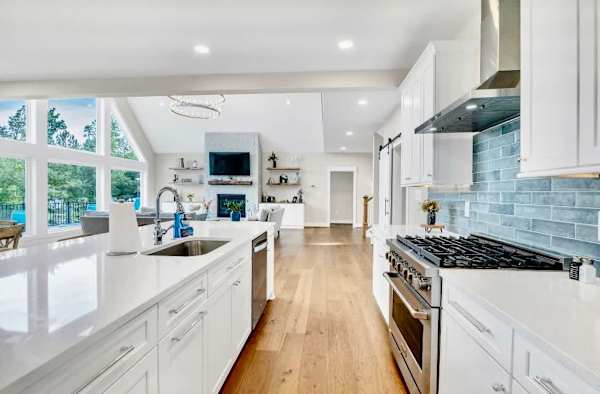 Kitchen -Welcome to our modern gourmet kitchen, featuring a high-end gas range, quartz countertops, a stunning 10-foot island, and all the amenities needed to create memorable meals & moments together. Check out all the details in the following pics