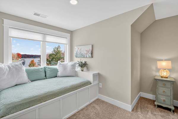 Our custom built-in full size beds with teal bedding & lake views offers a cozy reading nook & amazing lake views, but BEST of all a full size bed for kids. We provide extra bedding/sheets/pillows for these beds and the mattresses are very cozy!