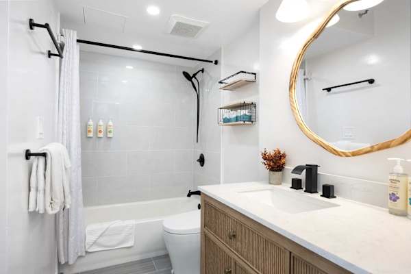Full bathroom with tub and shower combination