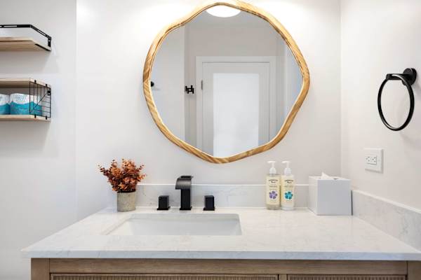 Your bathroom has a beautiful vanity with cabinets