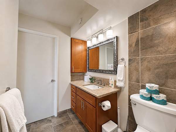 Your bathroom has a vanity with cabinets for storage