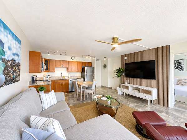 Relax on your sectional sleeper sofa and watch your favorite movies on the 65-inch Smart TV in the living area.