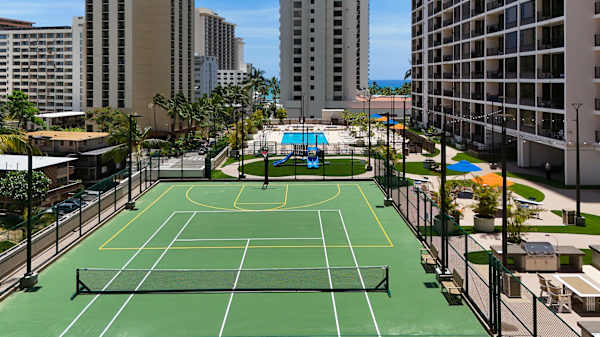 Full tennis and play court in the recreation deck