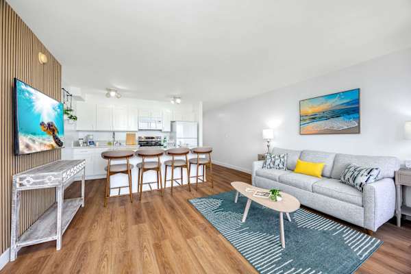 Relax in your living area with a pull-out sleeper sofa and a 55" smart TV