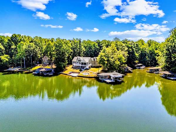 Aerial View - Tucked into a wooded cove on the quiet side of Lake Anna, with calm, open water just off the dock.