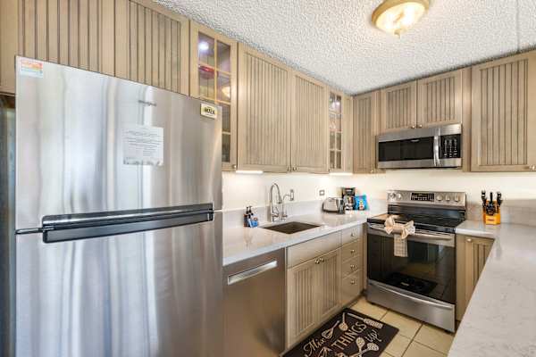 Channel your inner chef in this modern kitchen fully equipped with premium stainless steel appliances and sleek countertops.