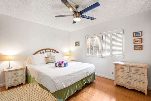 Unwind in pure comfort in your bright bedroom featuring a luxurious king-size bed