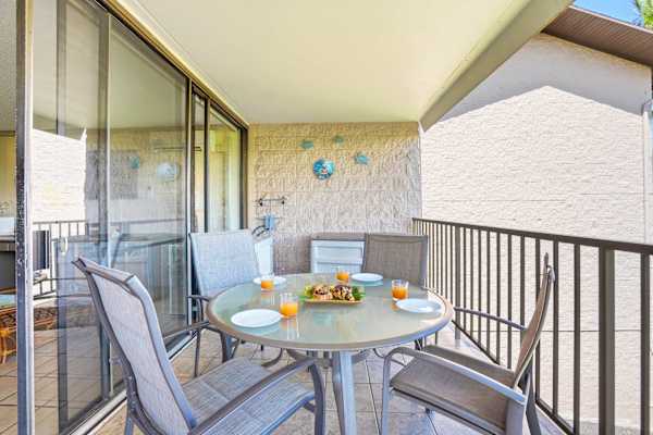 Step outside to your covered, spacious, private balcony where a glass-top dining table awaits for al fresco meals and morning coffee