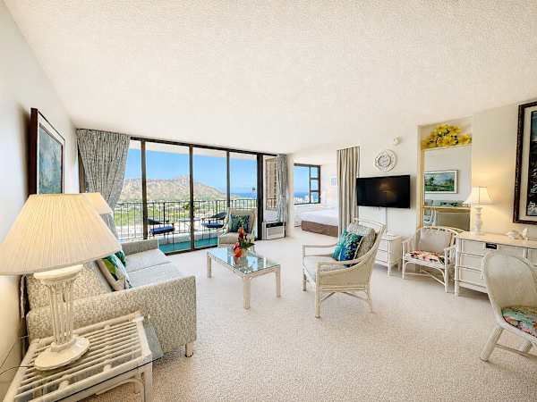 Wake up to stunning tropical views and breezy, sun-drenched living in this bright and airy condo.