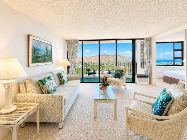 Relax in your living area where floor-to-ceiling glass doors frame magnificent views of Diamond Head and the turquoise sea