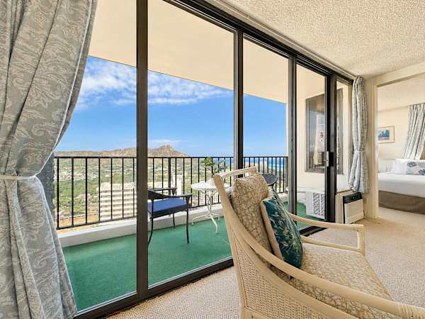 Relax indoors while soaking up the tropical landscape, or slide open the glass doors to enjoy your private balcony overlooking Diamond Head
