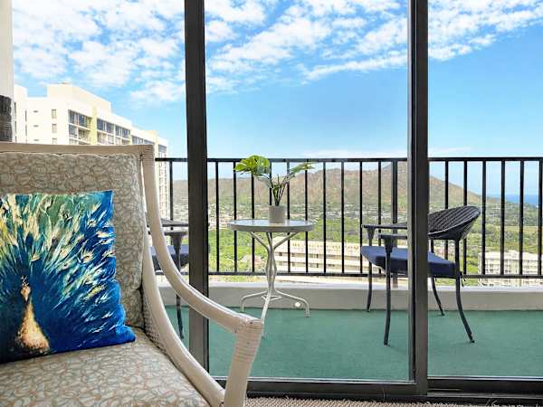 Step from indoor comfort straight onto your private, sun-drenched balcony to take in peaceful mountain and skyline views