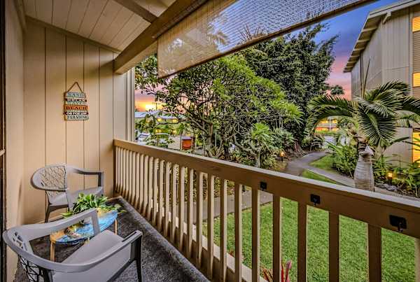 Relax on the covered lanai surrounded by tropical greenery.