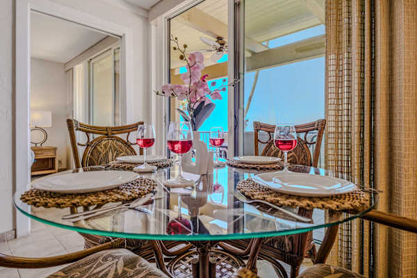 Cheers To Paradise Around An Elegant Glass Dining Table
