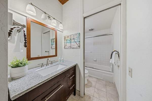 Brightly Lit Bathroom Styled with Sleek Finishes And Fresh Linens