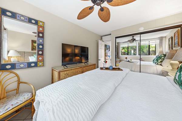 Spacious king bedroom with tropical-inspired décor
