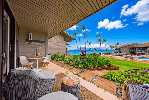 Covered lanai overlooking tropical gardens and the pool