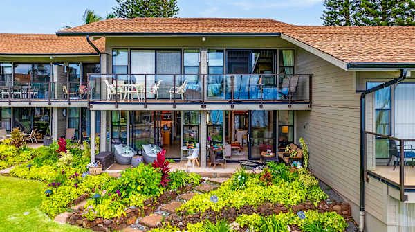 Resort-style exterior surrounded by tropical landscaping