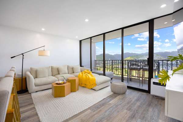Relax in your sectional sofa in the living area plus a direct lanai access with stunning mountain and city views.