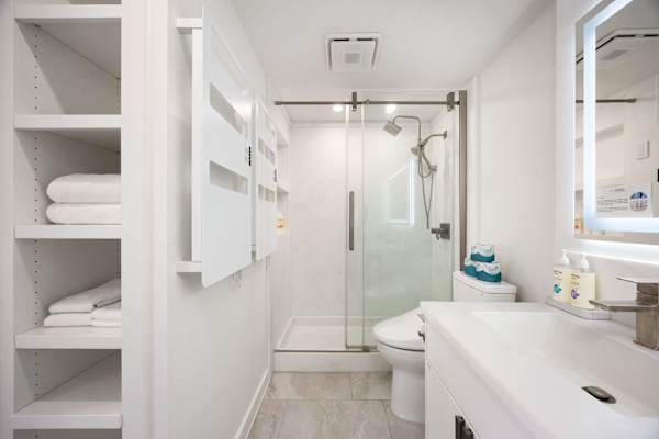 We provide one set of towels per guest! Your bathroom is complete with a walk-in shower.
