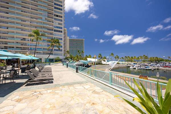 Relax in the deck pool area at Ilikai Hotel