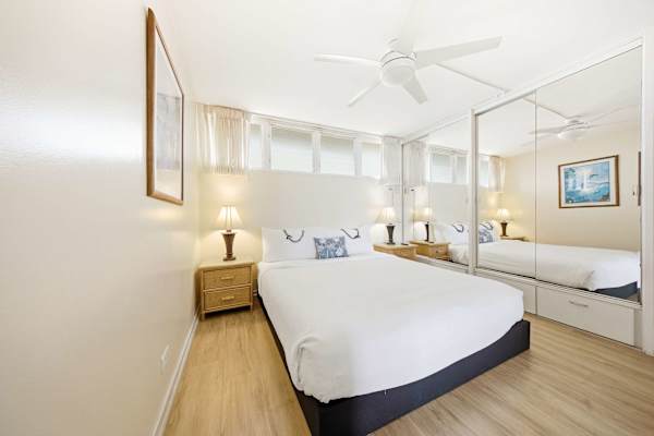 Serene Master Bedroom Retreat With Bright Mirrored Accents