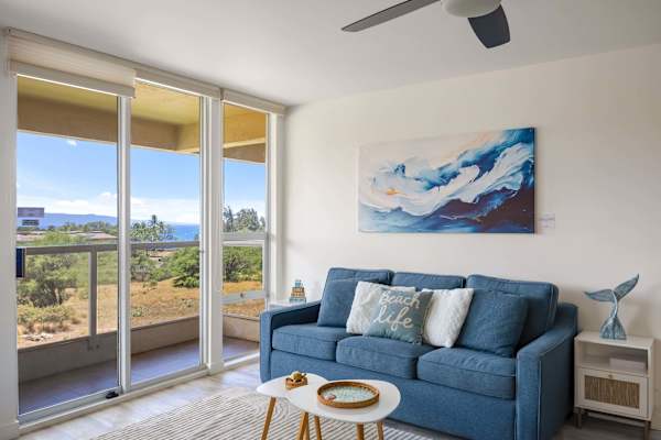 Lounge on the comfy ocean-blue sleeper sofa and soak in the bright, natural light and serene tropical views through floor-to-ceiling glass doors.