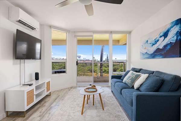 Unwind in your bright, sun-drenched living space featuring a sleeper sofa, split A/C, and a private balcony with relaxing tropical views.