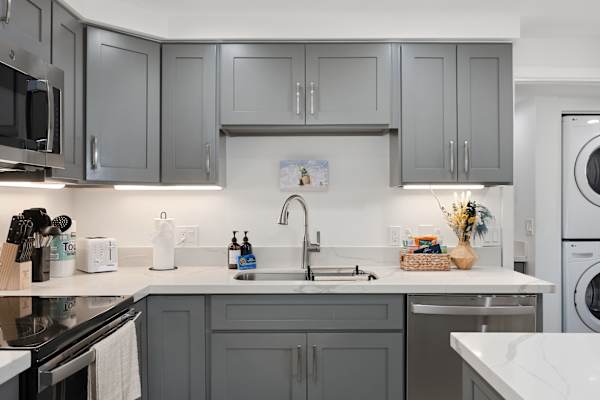 Appreciate the thoughtful setup with clean prep space, under-cabinet lighting, and an in-unit washer/dryer steps away.