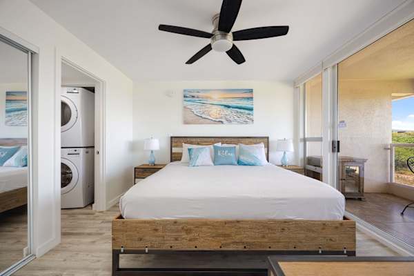 Enjoy ultimate convenience in your bright bedroom suite, featuring a king-size bed, an in-unit washer/dryer, and direct access to your private balcony.