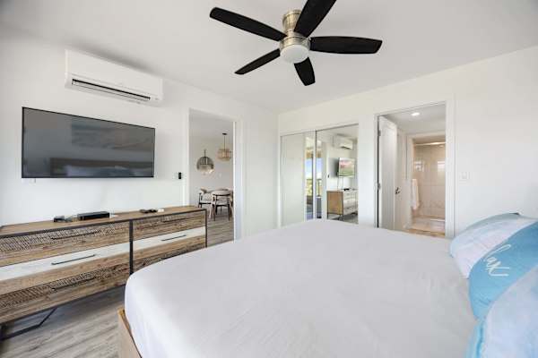 Unwind in total comfort in your bright bedroom, complete with a wall-mounted TV, dedicated split A/C, mirrored closets, and an en-suite bathroom.