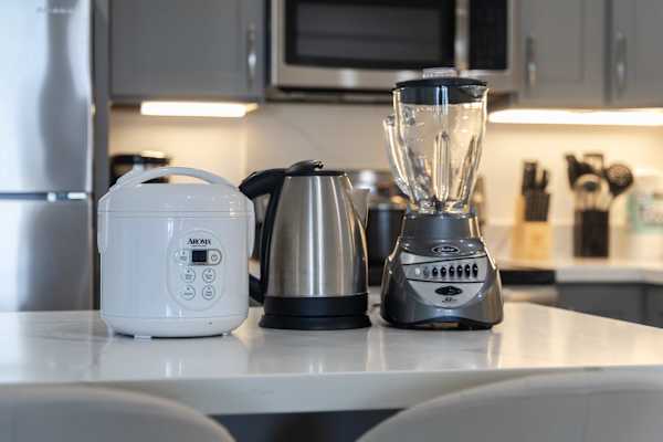 Equipped for all your culinary needs, the kitchen comes fully stocked with essential counter appliances, including a rice cooker, electric kettle, and blender.