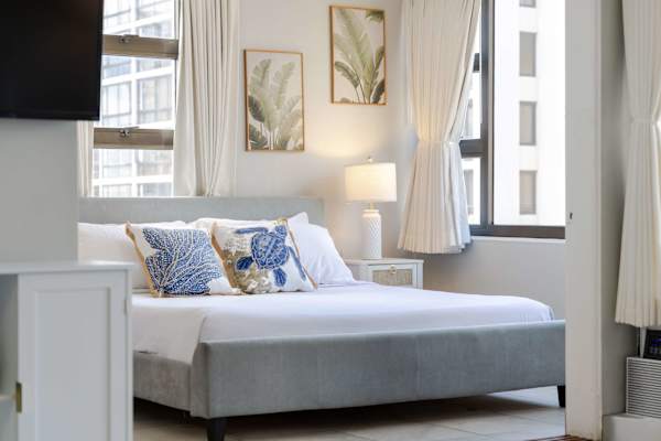 Unwind in style in your bedroom, offering a plush king bed, coastal accents, and great views.