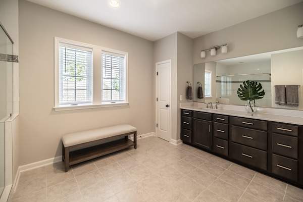 Primary Bath - Double vanity with generous counter space, steps from the primary bedroom.