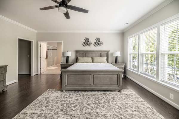 Primary Suite - A serene retreat with a king bed, private sitting area, and abundant natural light.