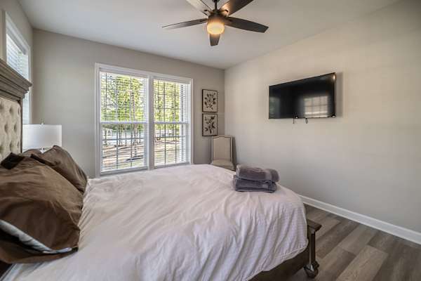 Bedroom 5 - A bright, comfortable room with a plush bed and lots of natural light.