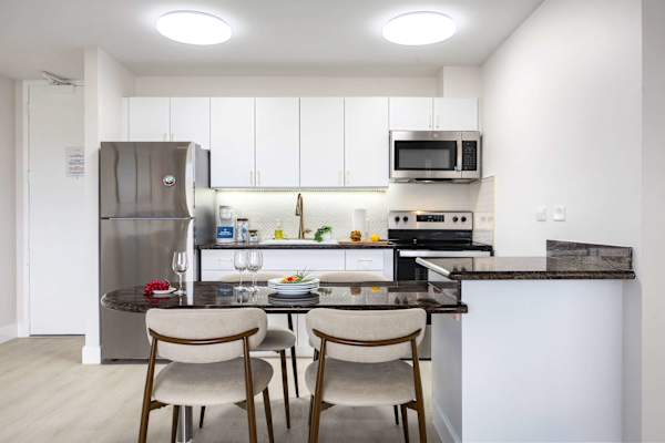 Dine in style at the elegant marble eating bar in your bright, fully equipped contemporary kitchen.