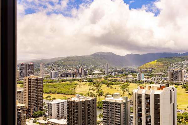 View of the city and the mountains from your bedroom window