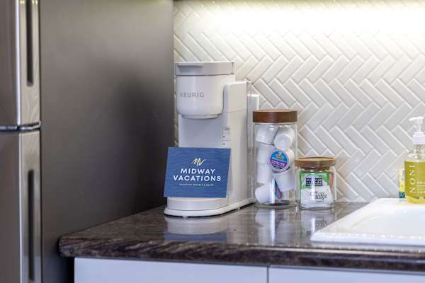 Start your mornings right with a dedicated coffee station featuring a Keurig coffee maker and complimentary pods.
